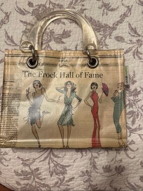 Handbag/tote couture planet handbag with acrylic handles. Recycle the magazines.